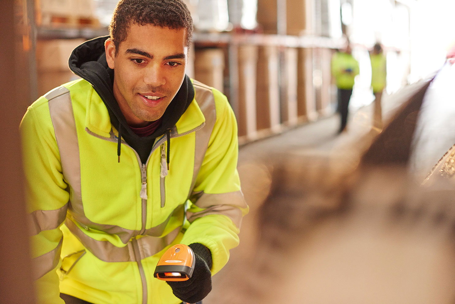 young worker stocktaking in warehouse