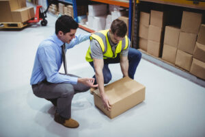 Manager training worker for health and safety measure in a large warehouse Online Manual Handling Training