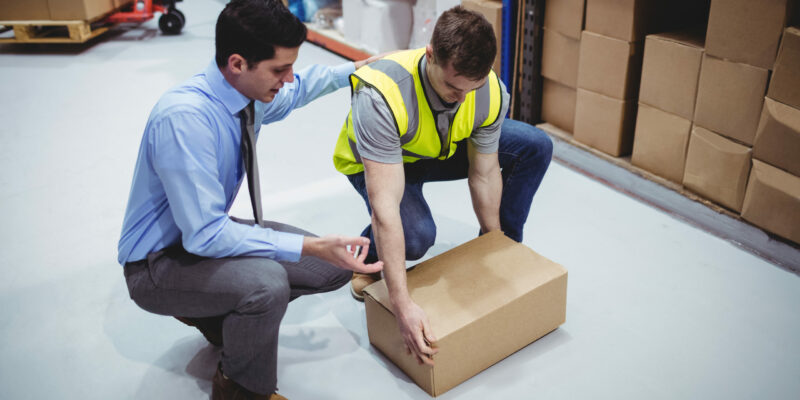 Manager training worker for health and safety measure in a large warehouse Online Manual Handling Training